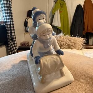 Porcelain Sledding Children Figurine